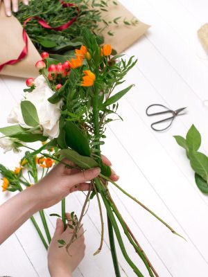 female-florist-making-beautiful-bouquet-flower-shop